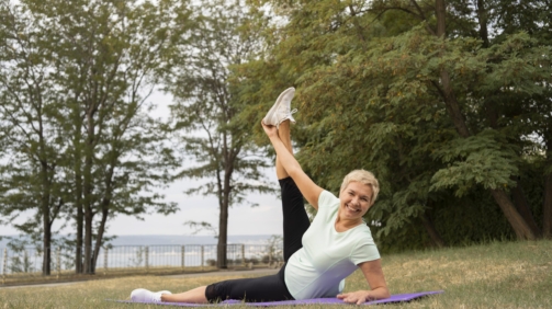 older-woman-doing-yoga-outdoors-park