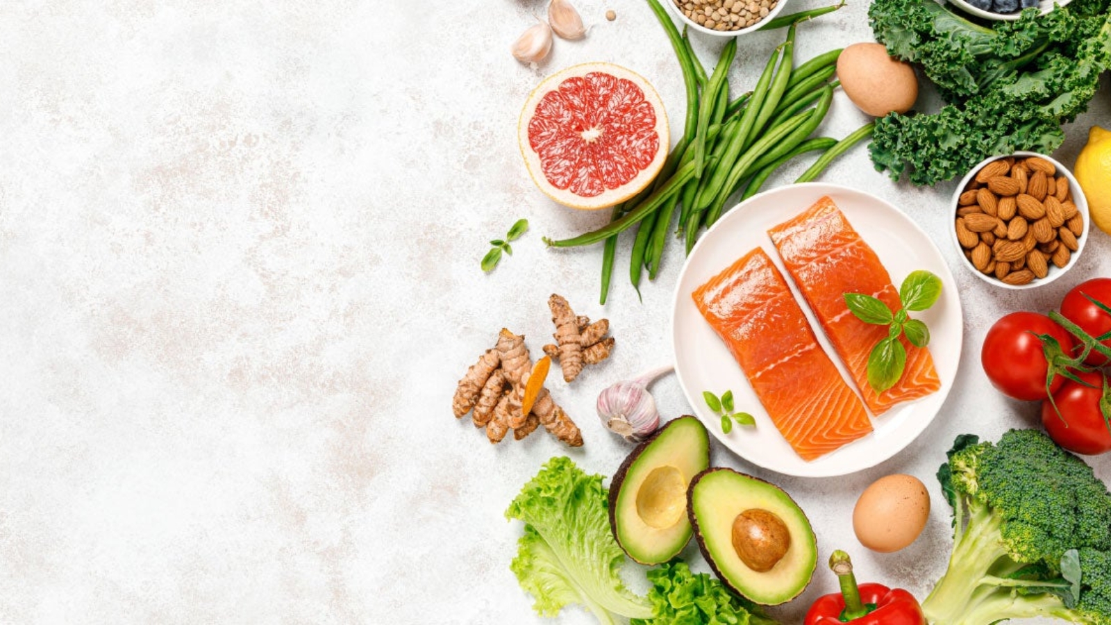 A colorful display of foods beneficial for managing menopause symptoms, including dairy products, whole grains, fruits like dark berries, vegetables, and omega-3-rich fish, set in a kitchen environment.